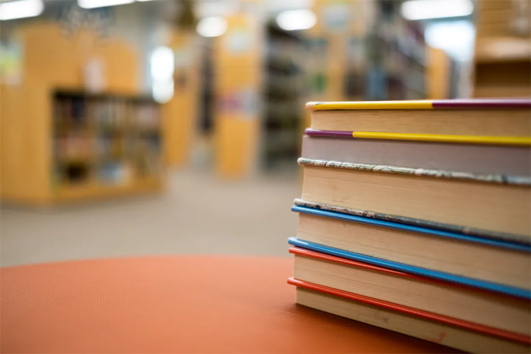 Zelienople Library A stack of books on a table in a library.