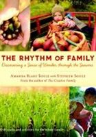 Zelienople Library Book cover of “The Rhythm of Family” with images of a child in a red wagon with produce, a hand holding berries, and a child crouching by green plants.